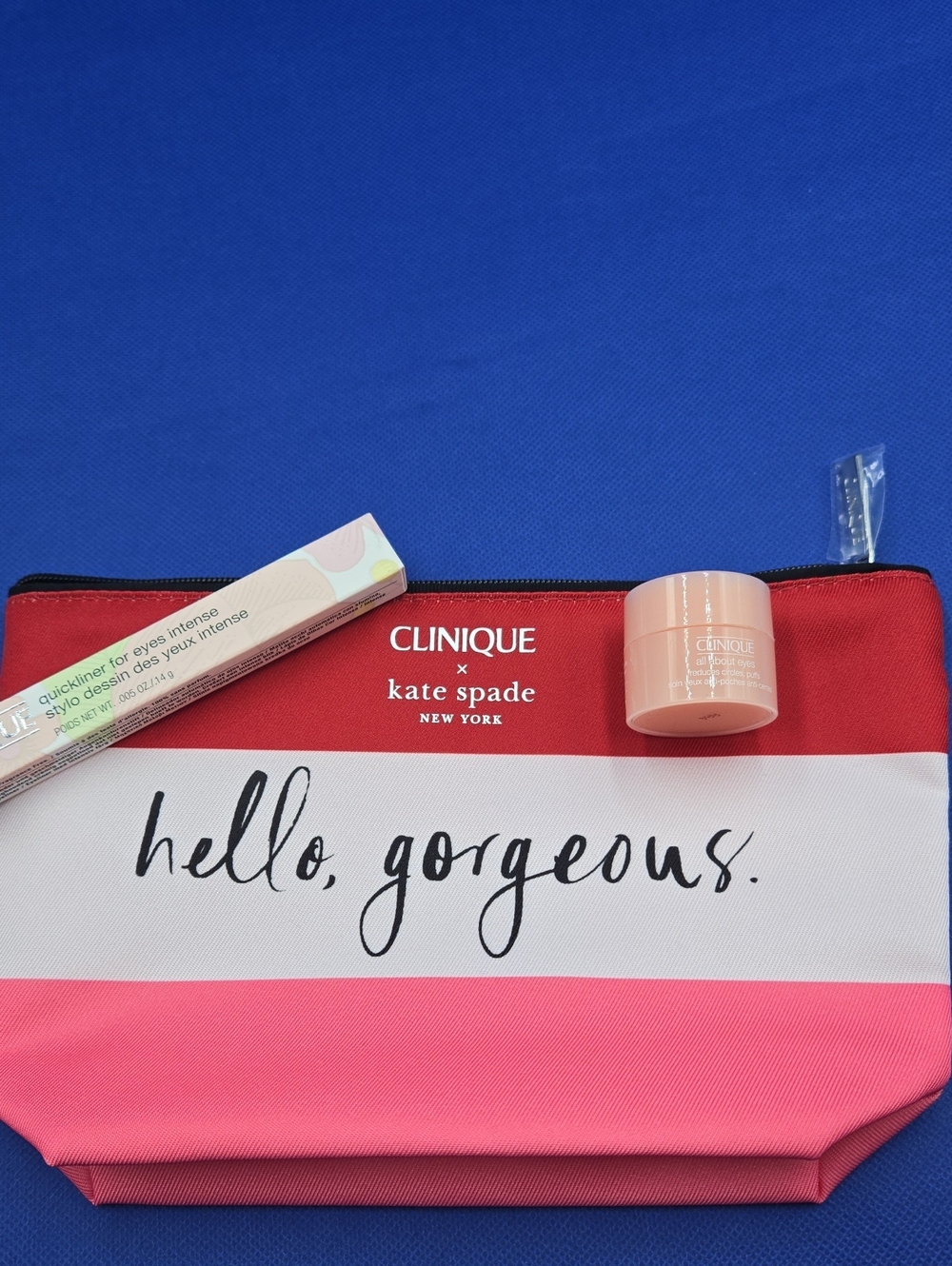 Clinique Pink and Red Striped Makeup Pouch with Mini Clinique Eye Care